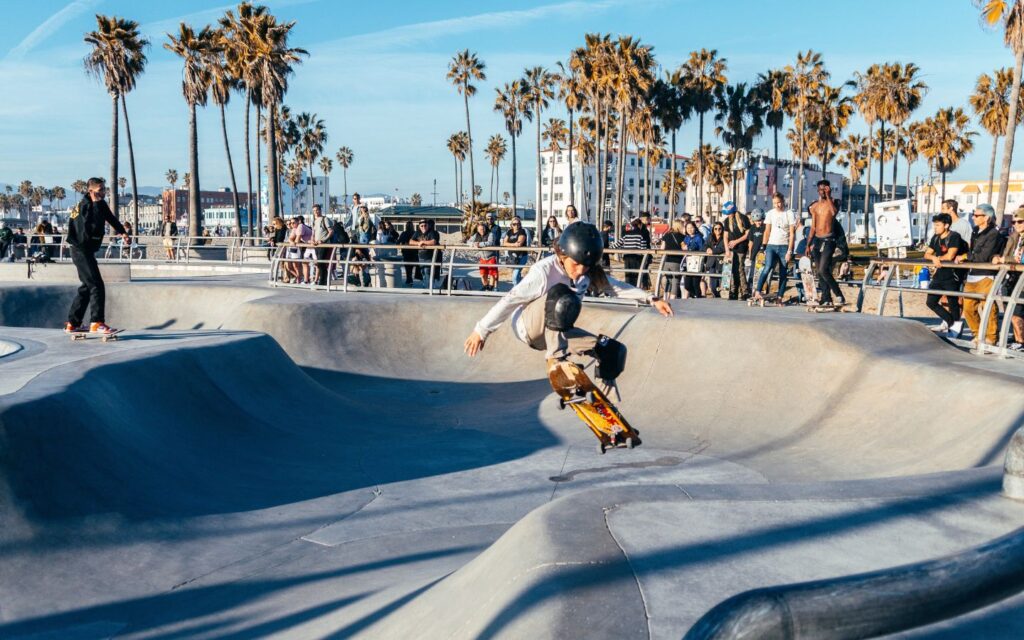 Skaters riding at outdoor skateparks in Dubai during sunset with open spaces and scenic surroundings.
