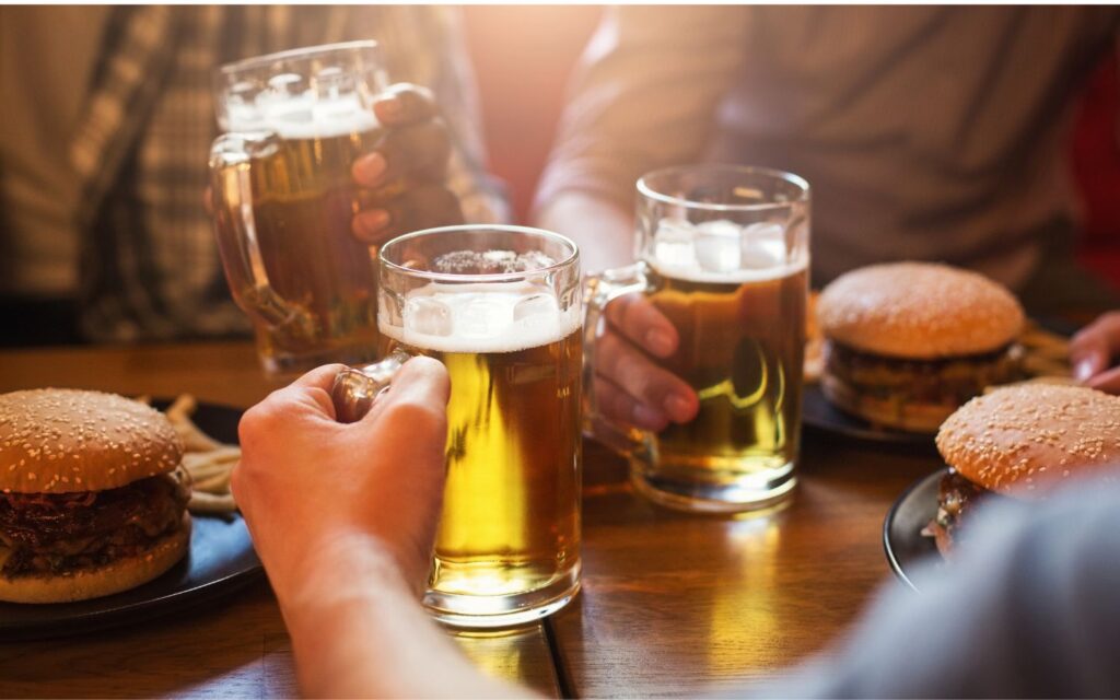 Guests raising pints and enjoying Irish brunch in Dubai.