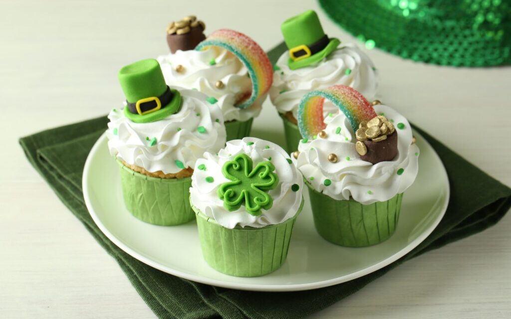 Colorful shamrock cupcakes on a table on St. Patrick’s Day.