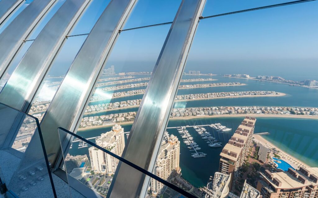 Panoramic Dubai skyline and Palm Jumeirah seen from The View at The Palm.