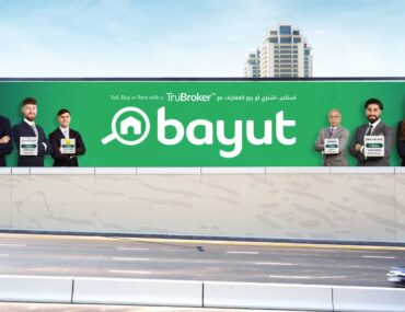 TruBrokers billboard on Umm Suqeim Street