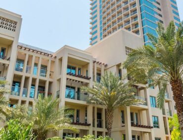 Apartment buildings in Dubai with palm trees
