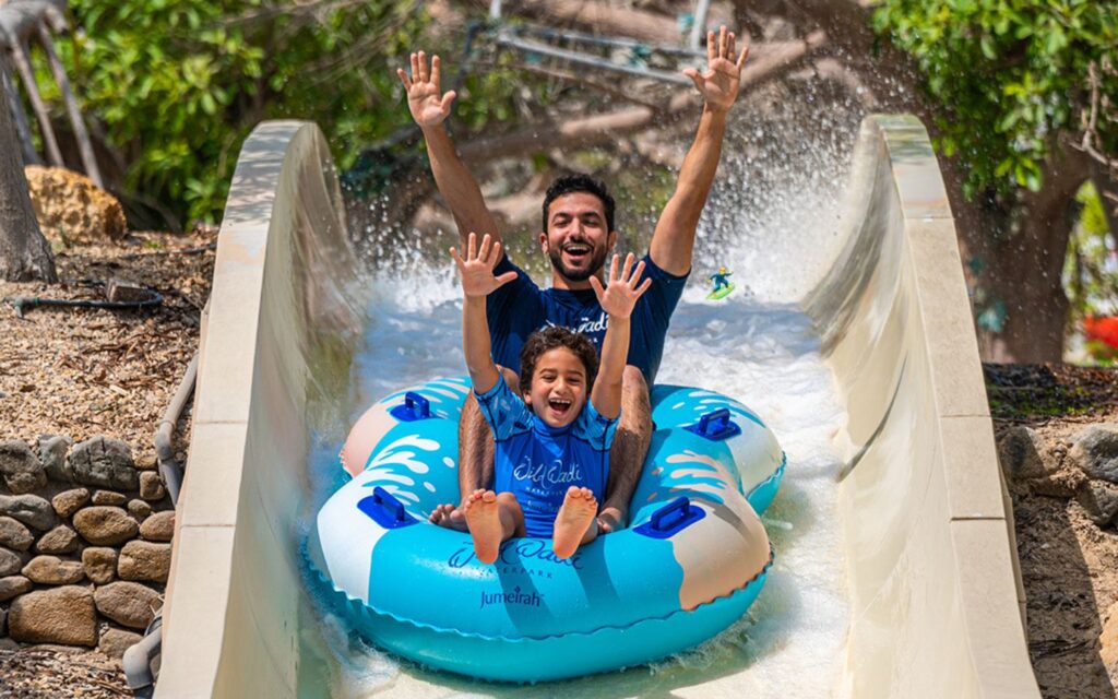 families enjoy at Wild Wadi Waterpark with Burj Al Arab backdrop