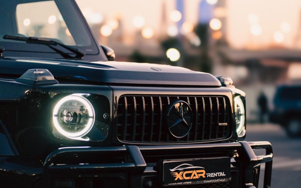 High-end sports car on a Dubai street, showcasing popular luxury car rental Dubai services by XCAR