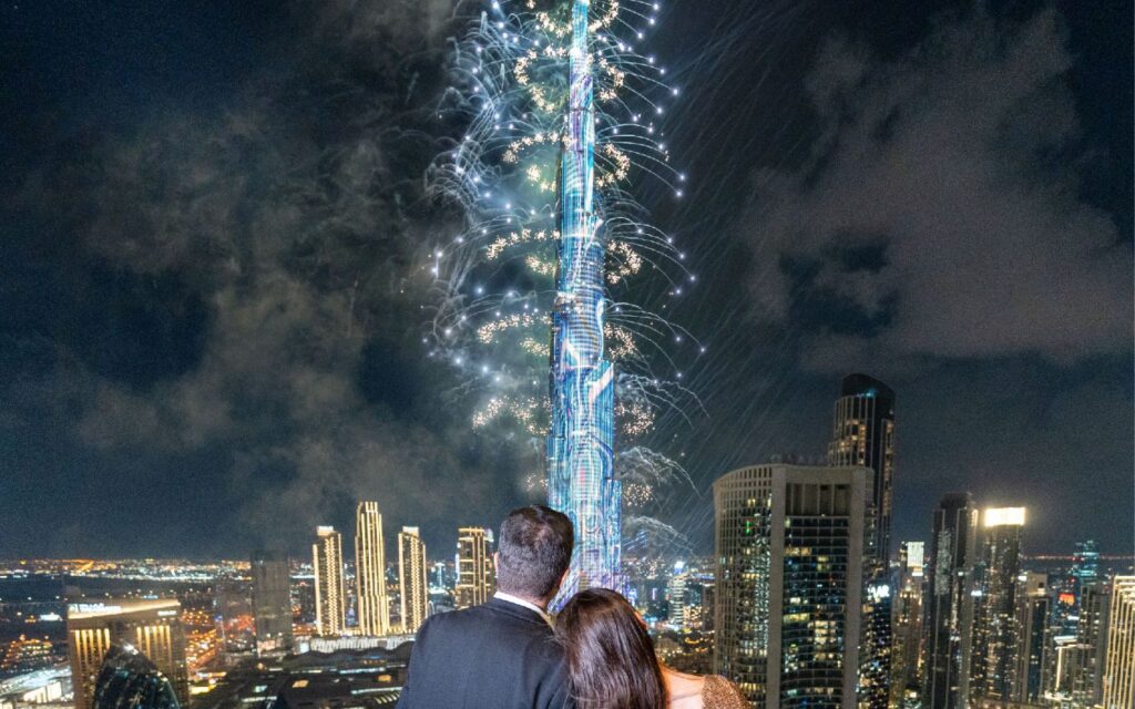 couple enjoying firework during festive season breaks in Dubai
