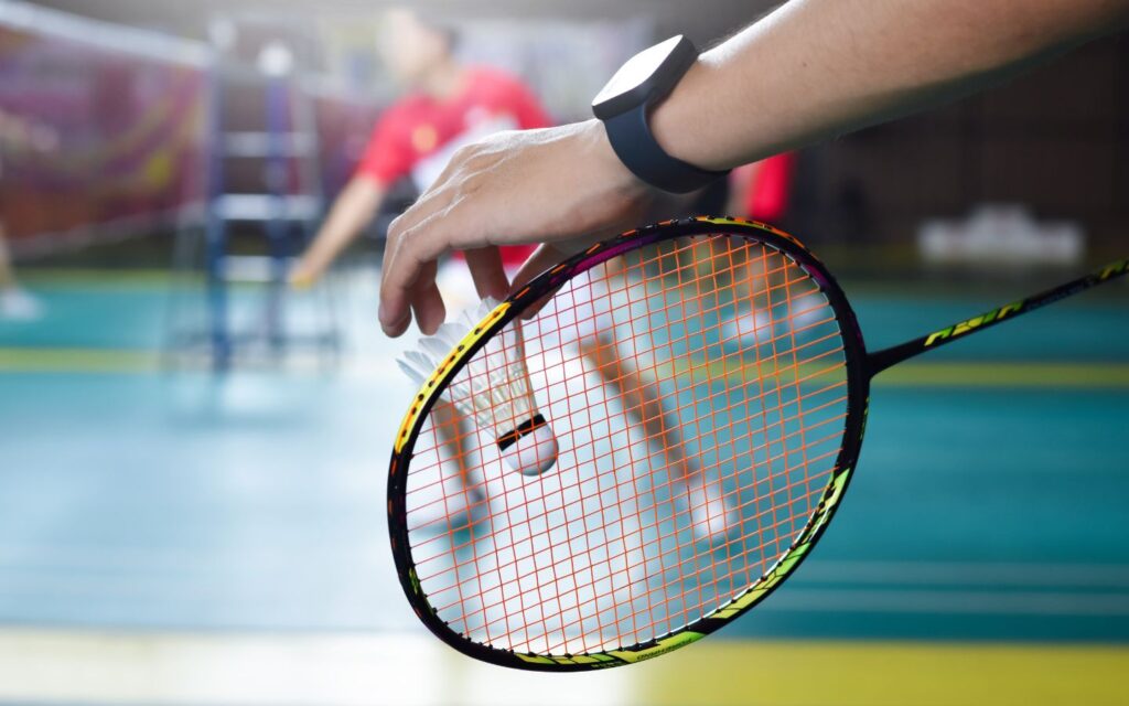 Players training with expert guidance during professional badminton coaching in Dubai.