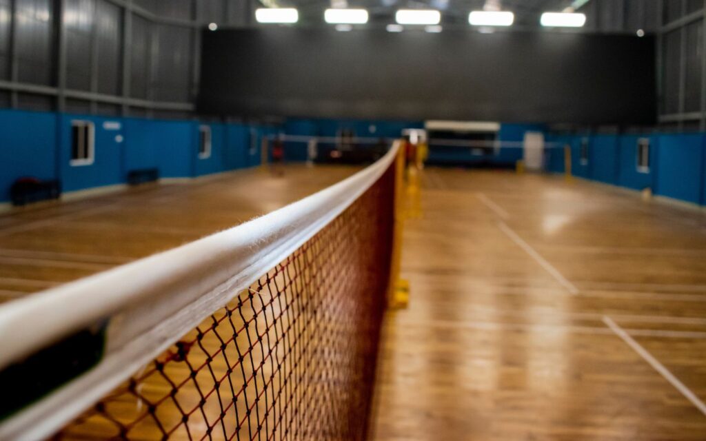 Bright badminton court in Dubai ready for energetic rallies and competitive play.
