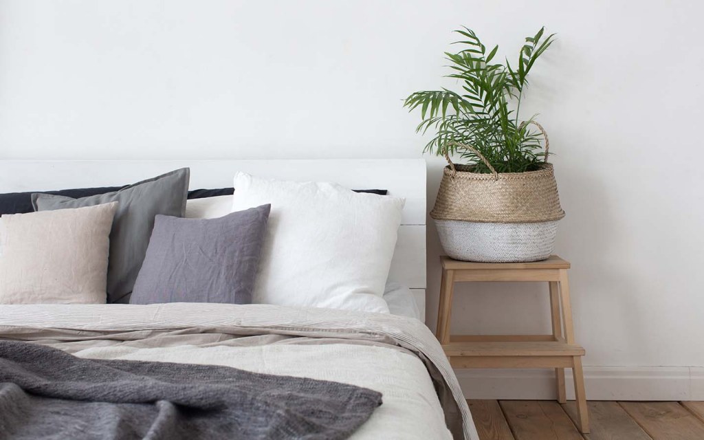 Cosy bedroom setup with neutral-toned decor and soft lighting