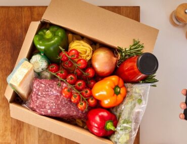 Recipe card and ingredients laid out from a Dubai home cooking kit