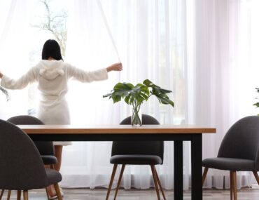 Minimalist living room with open layout and simple décor fostering a peaceful home environment.
