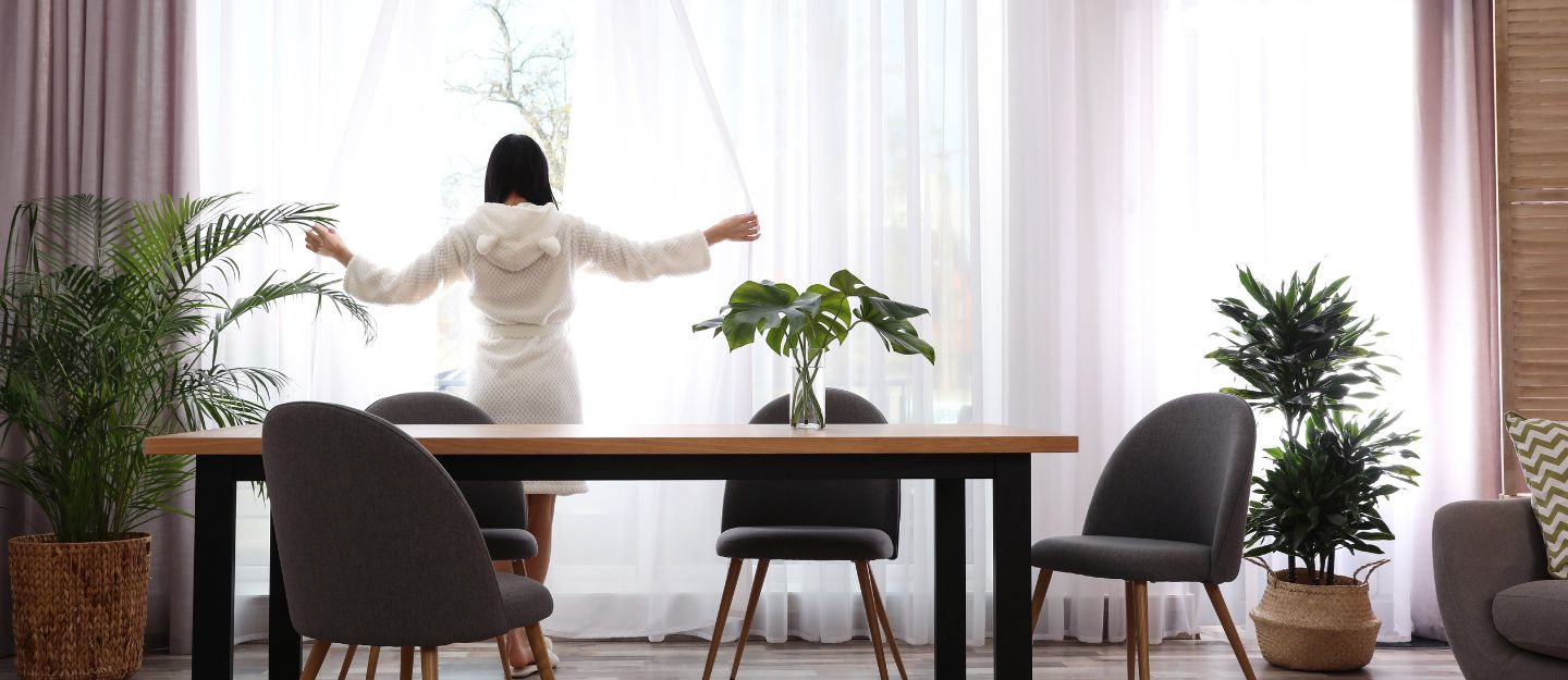 Minimalist living room with open layout and simple décor fostering a peaceful home environment.