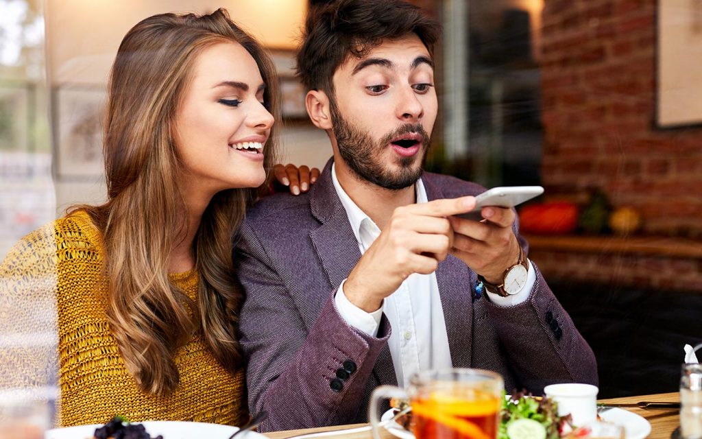 couple taking food pictures