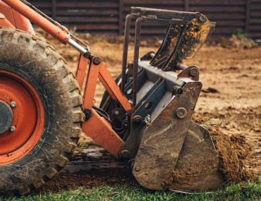 Bulldozer scooping up earth