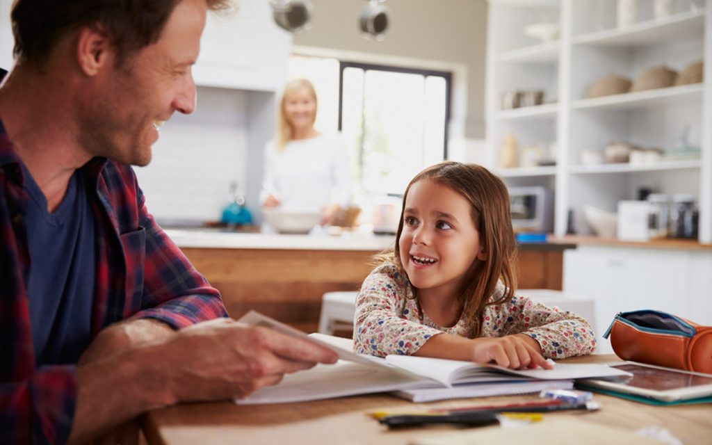 A father teaching his daugther