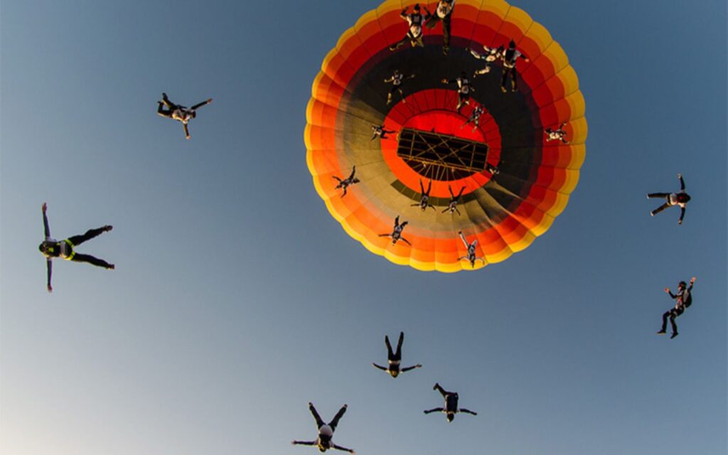 sky divers jumping out of parachute