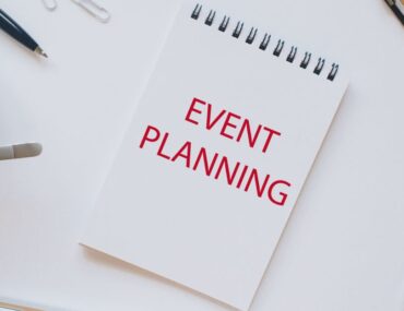 A professional writing pad nestled among organized stationery, curated by top event management companies in Abu Dhabi.