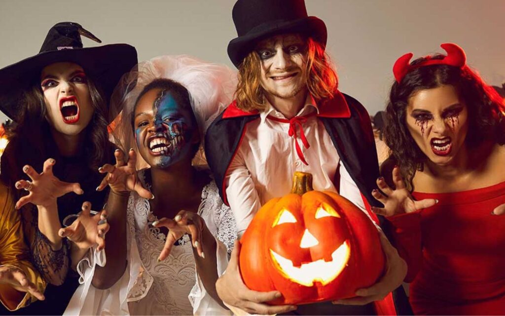 Friends in costume enjoying a halloween party