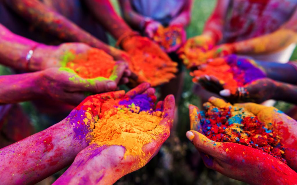 hands full of colourful powders