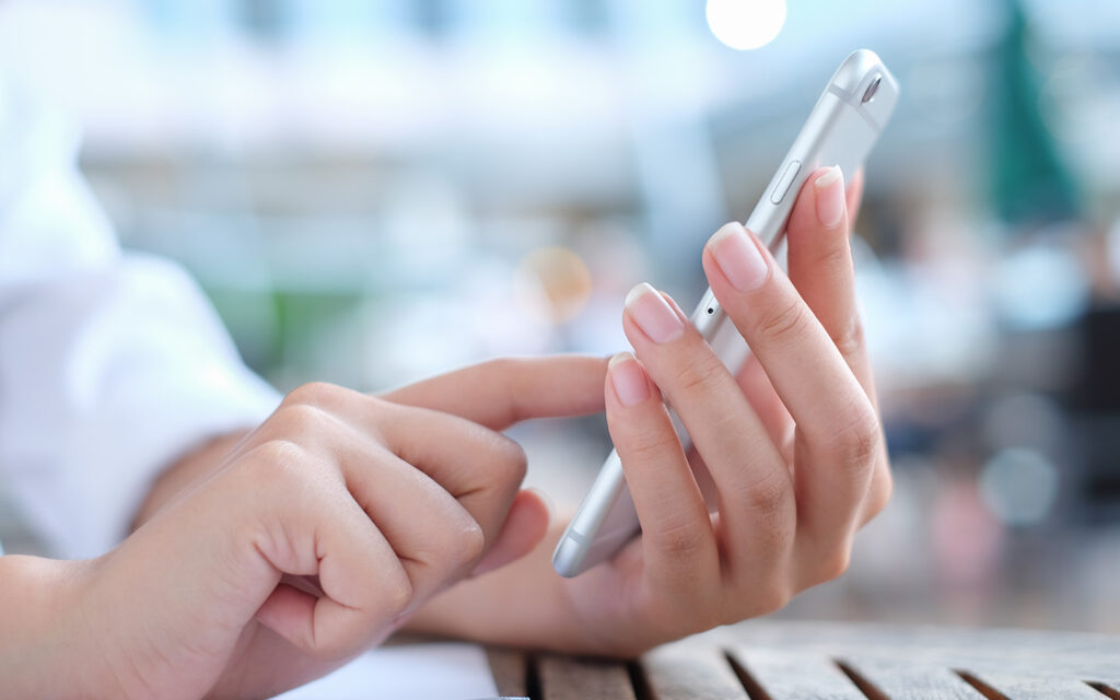 woman with phone in hand