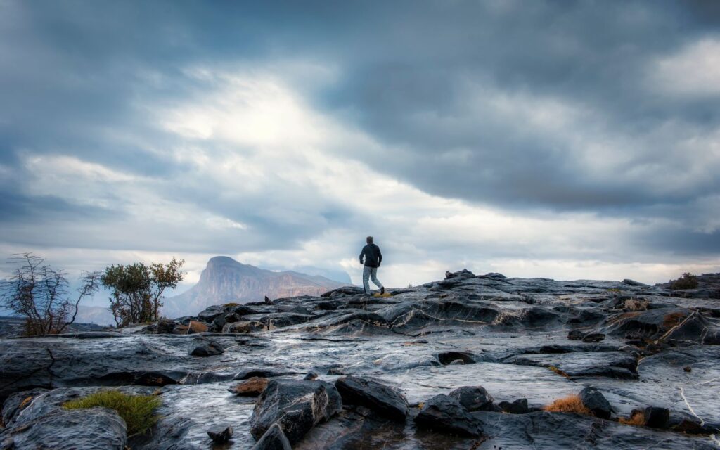 A traveler overlooking the landscapes of Oman.