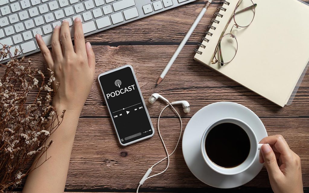 man listening to podcast while enjoying tea