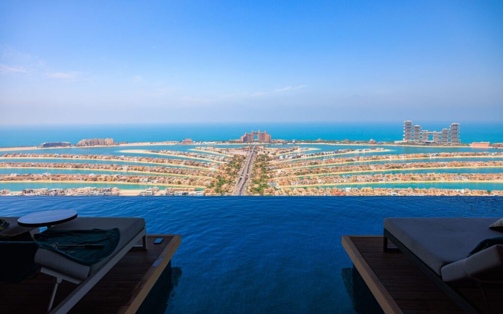 Relax at a rooftop infinity pool in Dubai with panoramic city views.