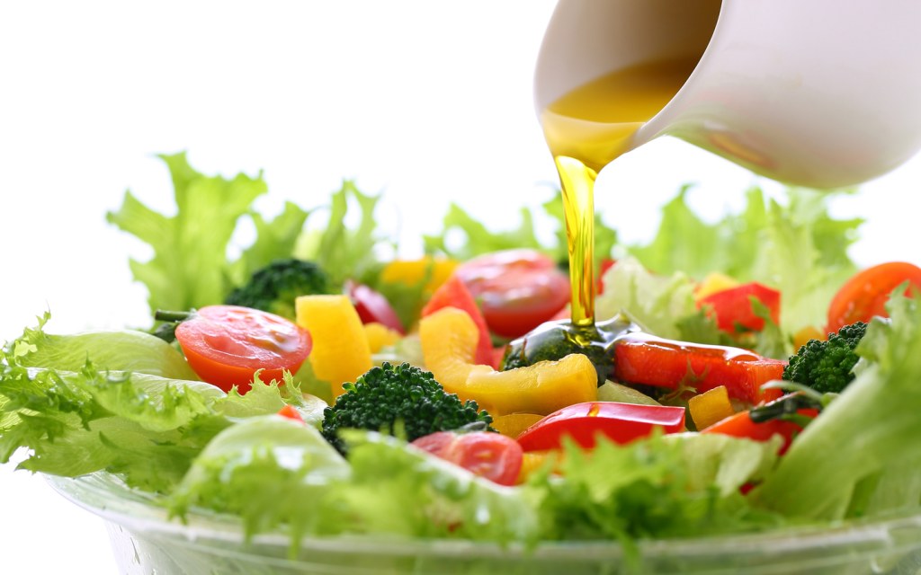 Honey dressing over vegetable salad