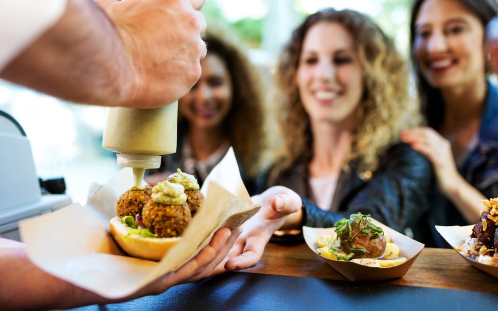 people enjoying food at a festival