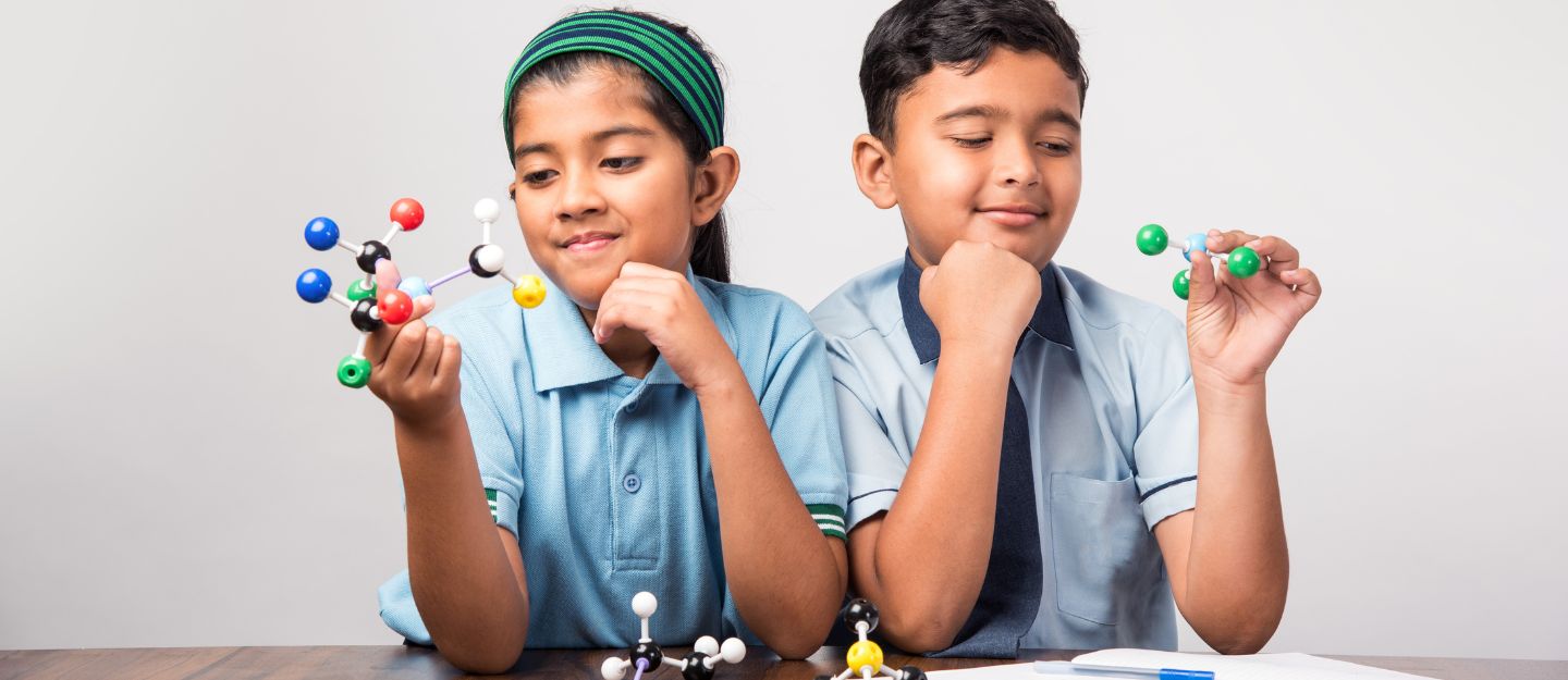 students performing science activity at one of the best indian schools in Sharjah