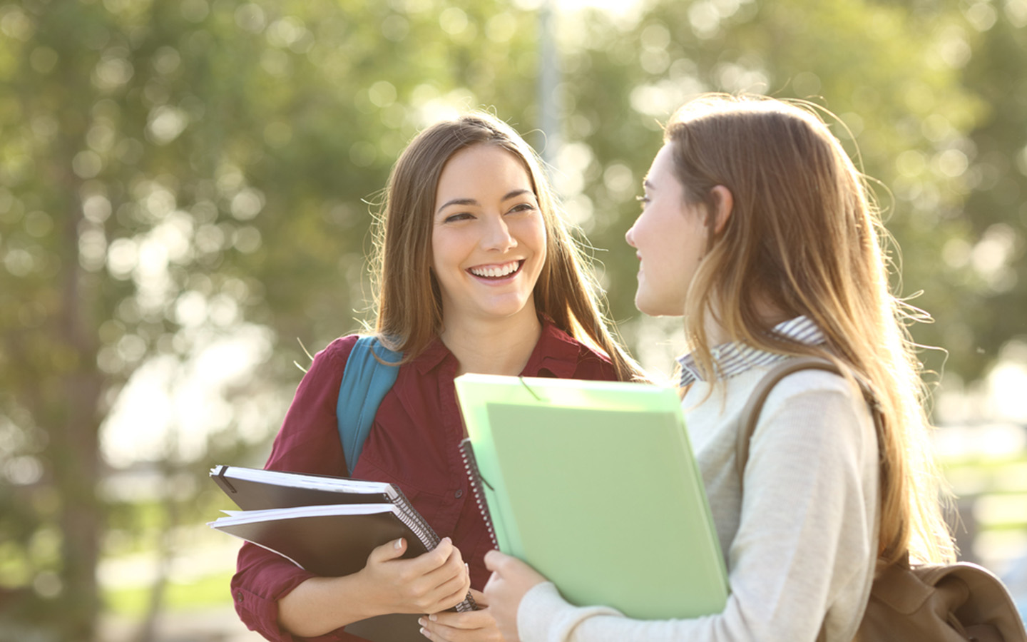 Two students discussing questions post-exam in a university