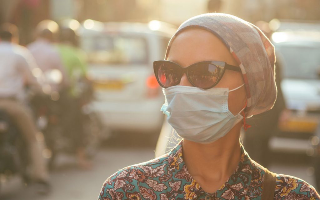 woman wearing a dust mask